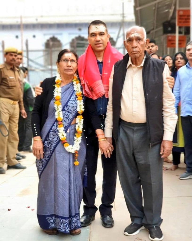 Navniet Sekera with mother and father.